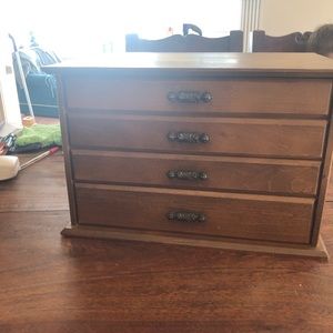 Vintage solid wood flatware four drawer storage with red felt lining.